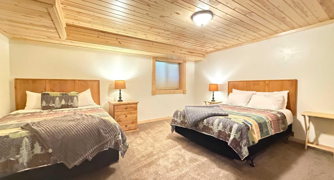 Bedroom #7 located downstairs with 2 Queen beds.