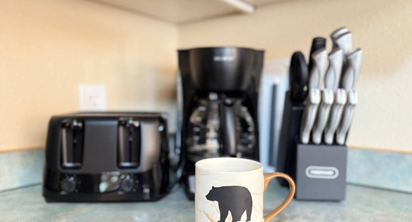 Toaster, drip coffee maker and knife block.
