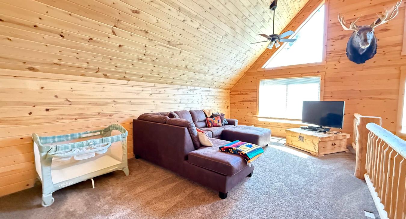 Designed with families in mind, the spacious media loft comfortably accommodates everyone and includes a convenient Pack 'n Play baby crib for your little ones.
