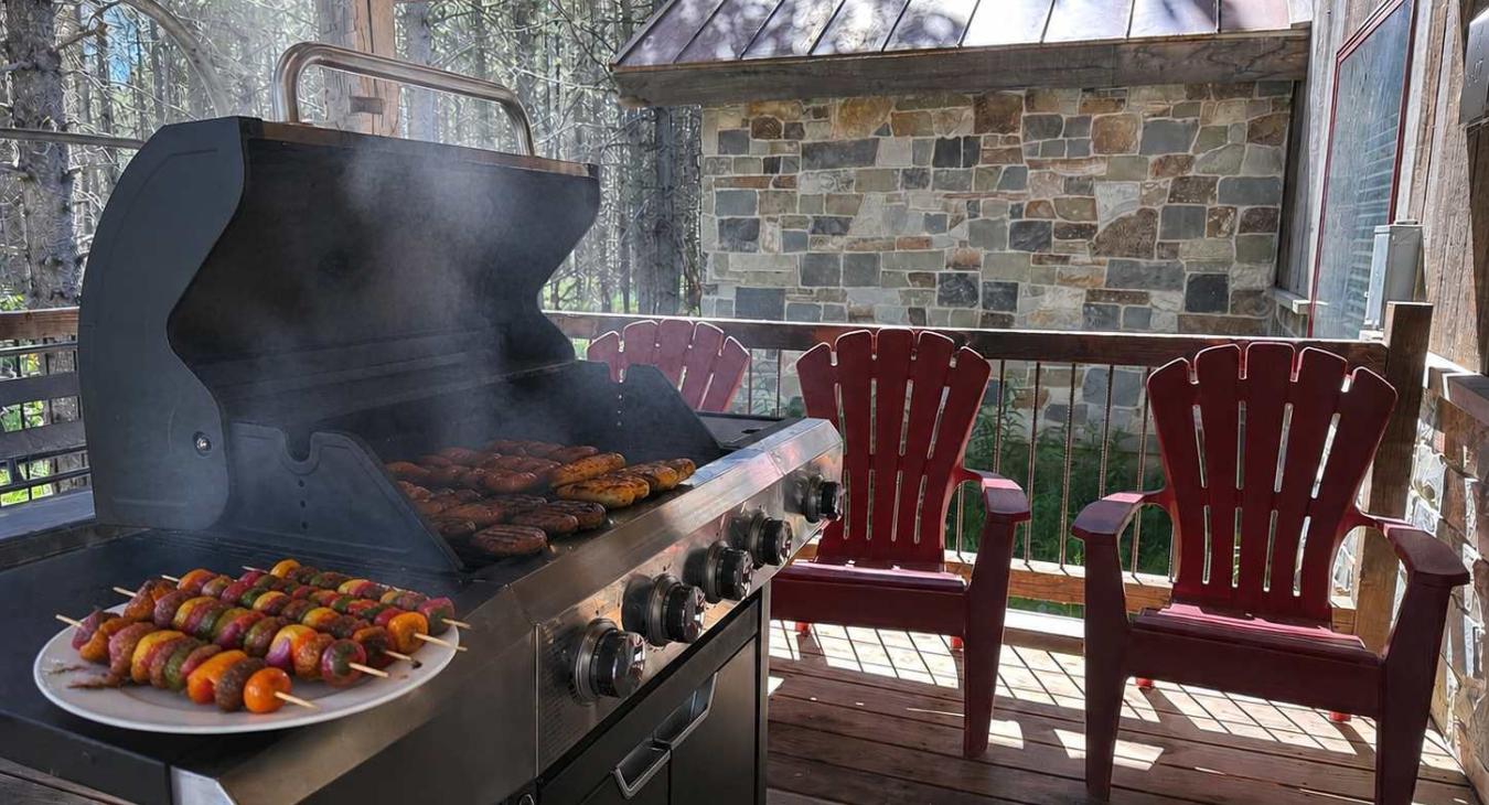 Propane grill on the front porch and seating.