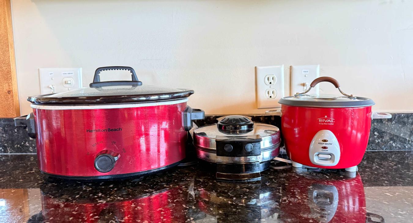 Fully stocked with convenient small appliances like a slow cooker and rice cooker, making home-cooked vacation meals effortless.