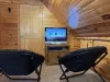 Tv and small chairs upstairs in the loft.