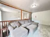 In the loft area there is a large couch and a 55 inch Smart tv. There is also a DVD player included in the entertainment center.
