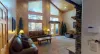 Natural light pours in through large windows, tying it all together with a view of the forest just beyond.