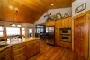 Kitchen equipped with stainless steel appliances, pots and pans, and basic cooking essentials.