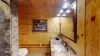 Downstairs there is a shared bathroom with large counter space, toilet, and a walk in shower.