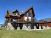 This cabin exudes rustic charm while seamlessly blending into the natural beauty of its surroundings.