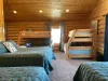 The overall design of the room balances functionality with comfort, with each area of the room offering a sense of privacy while still maintaining an open, communal feel.