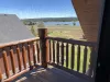 This room also has access to the deck to enjoy the outdoor landscape Island Park has to offer.