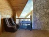 Located within the loft is two comfortable chairs and a pack and play for you to use for your little ones.