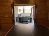 From the door of the game room you can access the large hot tub this cabin has to offer.