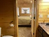 Upstairs in-between the two rooms is a shared Jack and Jill bathroom. It offers ample storage and counter space and a shower tub combo.