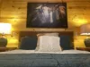 The second bedroom mirrors the first, with its own unique charm but a similar rustic atmosphere with a Queen size bed.