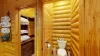 To the right of the closet there is a small toilet with a door for added privacy.