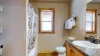 Downstairs bathroom with clean towels provided.