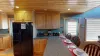 Full size kitchen with appliances, cookware, dishes, utensils, and basic cooking essentials.