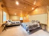 Second upstairs bedroom with 2 queen beds and balcony.