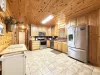 Full size kitchen with appliances, cookware, dishes, and basic cooking essentials.