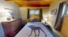 The master bedroom is located on the main level with a queen size bed.