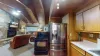 Kitchen with basic appliances and spices.