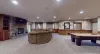 Basement living area with lots of space, seating, and entertainment.