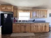 Kitchen with appliances, basic cooking essentials, dishes, silverware, and basic spices.