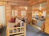 Lots of seating and windows to bring a cozy atmosphere to the cabin.