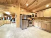 Full kitchen with appliances, cookware, dishes, silverware, and basic cooking spices.