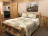 Bedroom #8 located downstairs with a Queen and a bunkbed.