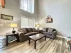 The living room near the kitchen in our cabin has a homey feel. Kick back and relax during your stay at The ALY Legacy Cabin.