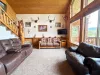 Upon entrance of the cabin you are welcomed by the living room.