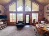 Natural light pours in through large windows, tying it all together with a view of the forest just beyond.