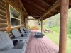 The expansive wrap-around deck offers plenty of outdoor seating and perfect spaces for gathering with family while taking in the fresh mountain air.