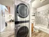 Full size stacked washer and dryer included next to the bathroom. Laundry soap is provided.