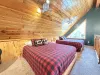 Upstairs loft with 2 queen beds to comfortably sleep 4 people.