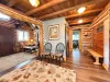 The warm and welcoming entryway features smooth hardwood floors, cozy bench seating, and classic rustic decor that makes you feel right at home.
