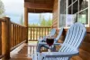 Porch with seating to enjoy the scenery.