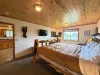King bed in the Master Suite. Smart tv and desk.