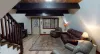 The living room is equipped with seating to relax after a long day.