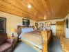 Master bedroom located on the main level with a king bed and ensuite bathroom.