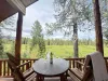 Chair on the porch overlooking the creek.