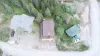 This full overhead view highlights the property's layout, offering a private lot with ample parking space for multiple vehicles or trailers.