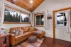The living room with seating and tv for entertainment.