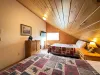 Bedroom 1 has 2 queen beds and a smart tv