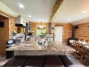 Whip up delicious family meals in the expansive kitchen, featuring a massive premium granite island with comfortable leather-cushioned barstools.