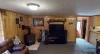 Living room is equipped with seating and a fireplace.