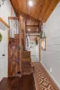 Hallway photo shows the climb in loft and access to the main level bedroom.