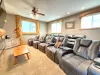 Spacious and incredibly inviting, the theater loft handles large groups with ease, offering endless comfort for late-night entertainment.